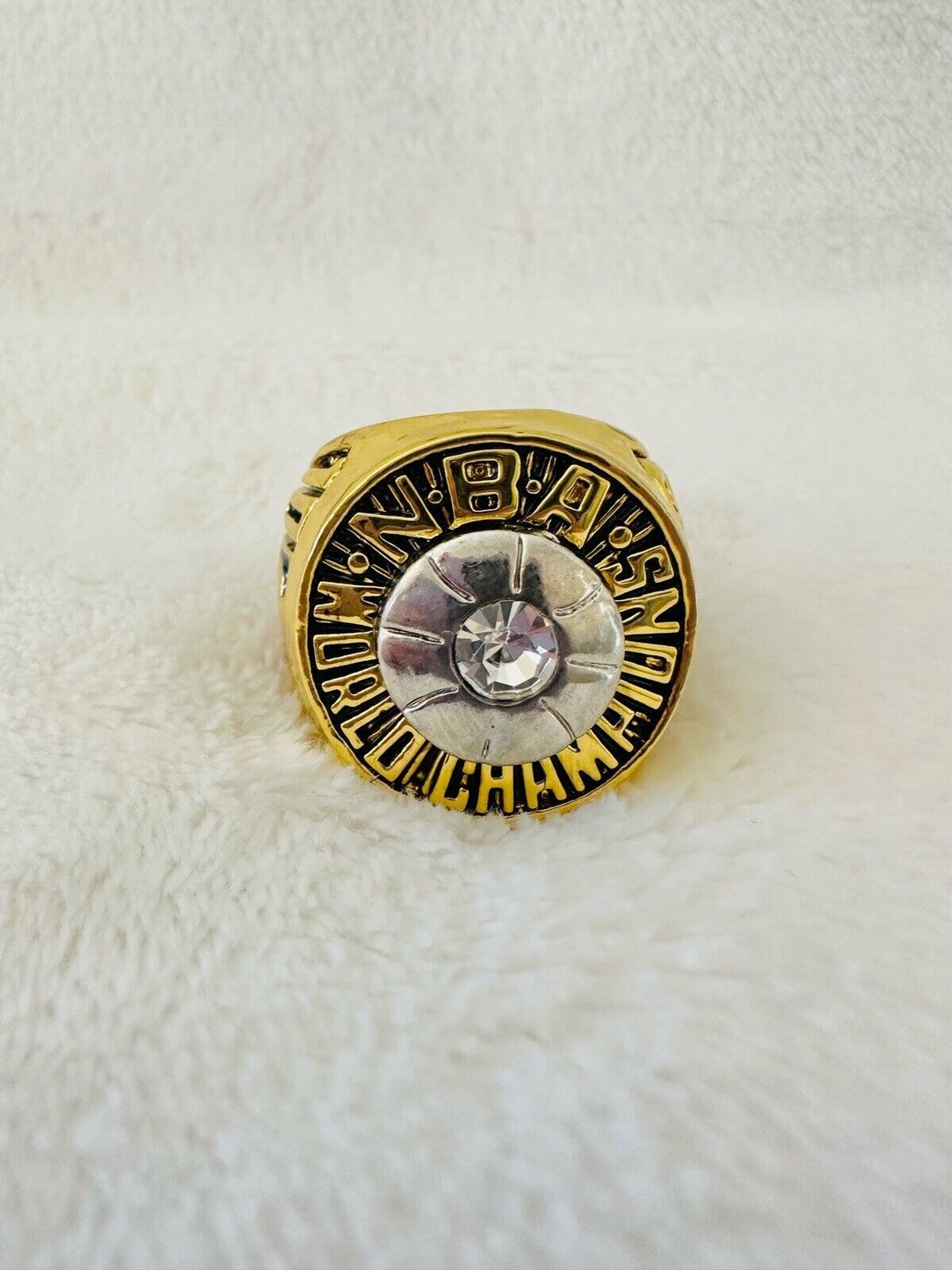 1970 New York Knicks NBA World Championship replica ring with detailed design and gold finish, displayed on a plain background.