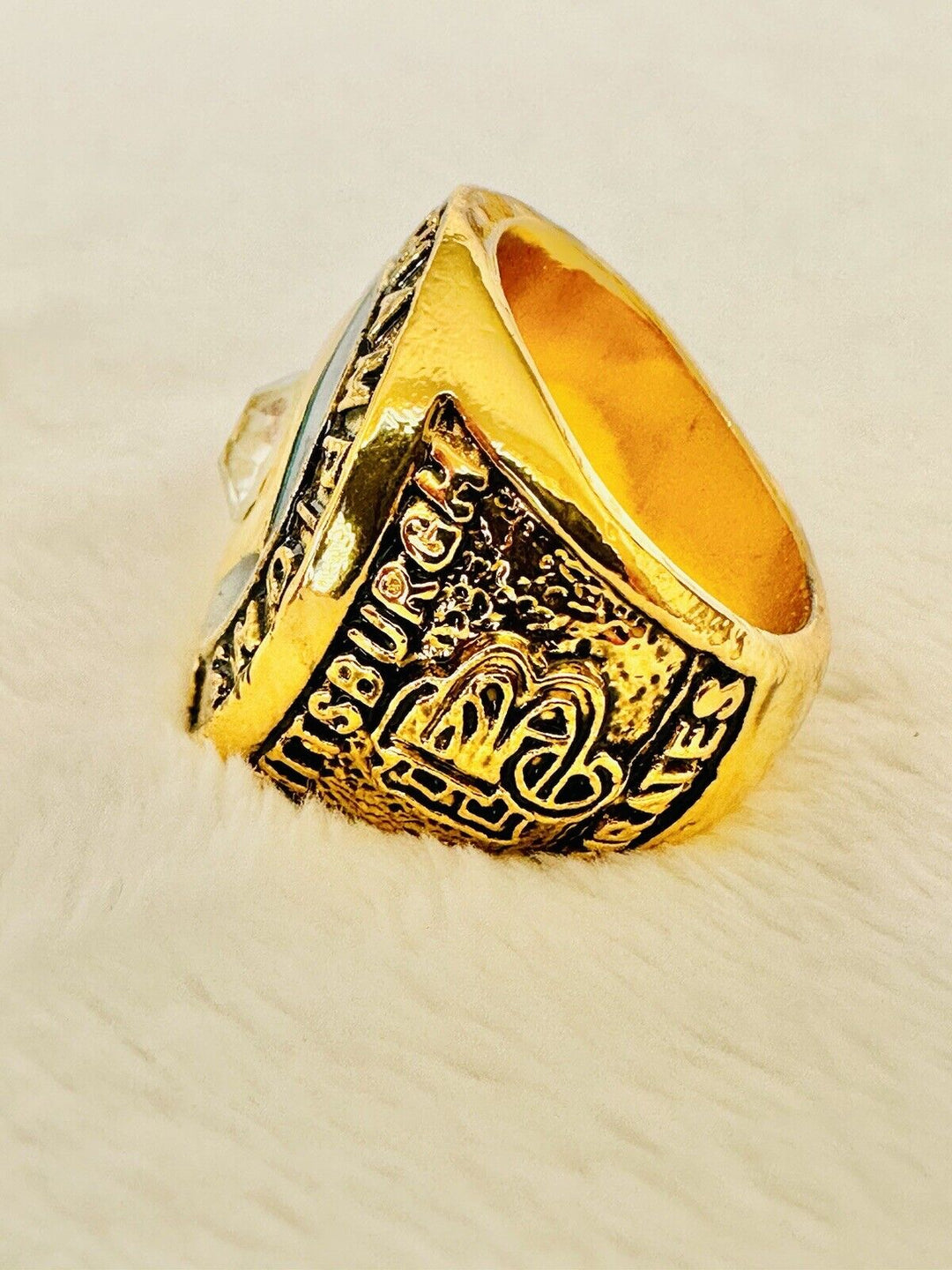 1909 Pittsburgh Pirates World Series Championship ring with intricate detailing, vintage style, and engraved team logo.
