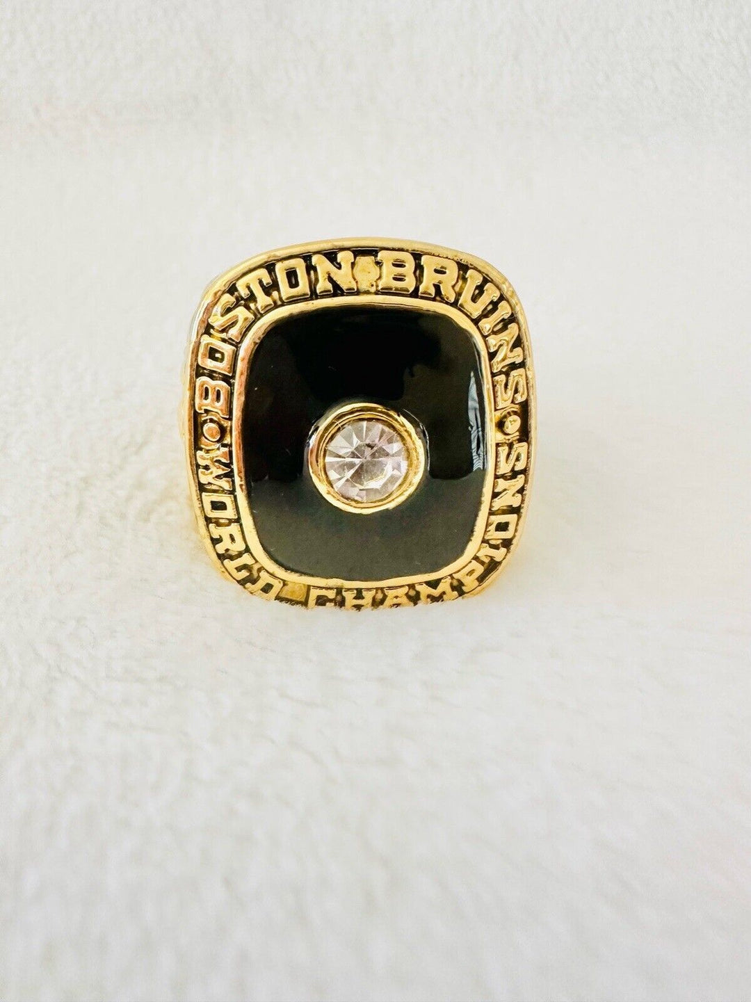 1970 Boston Bruins Stanley Cup hockey ring with engraved details, showcasing a classic NHL sports memorabilia piece by EBSportsRings.com.