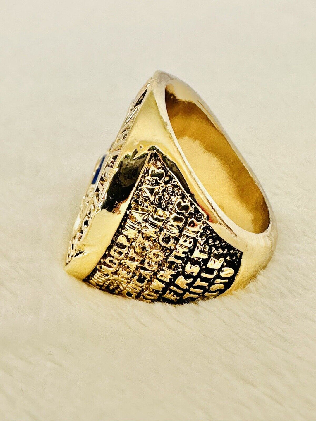 Philadelphia Athletics 1910 World Series Championship ring with detailed engravings, displayed on a neutral background.