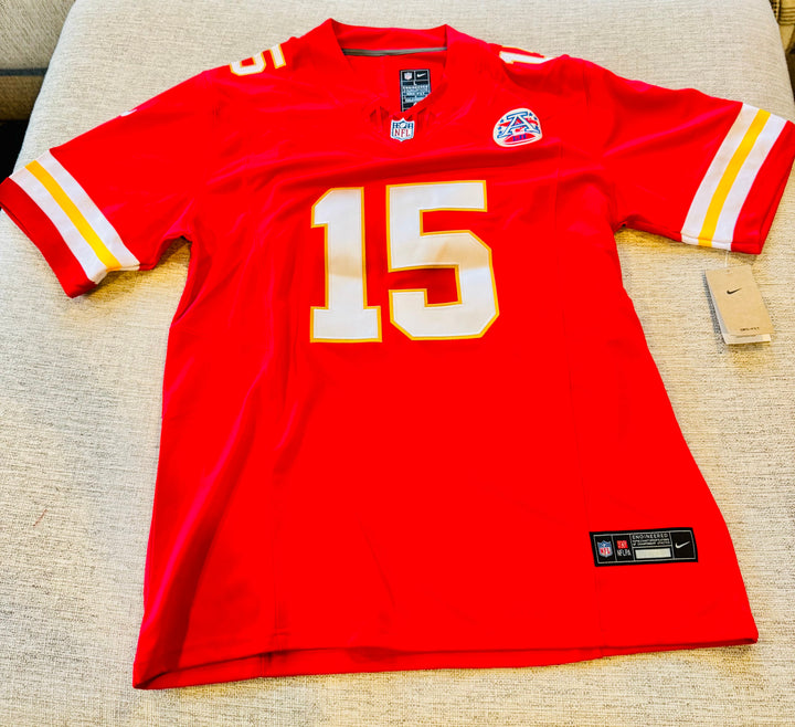 Patrick Mahomes Kansas City Chiefs NFL jersey displayed with team logos and player name in authentic sports fan apparel.