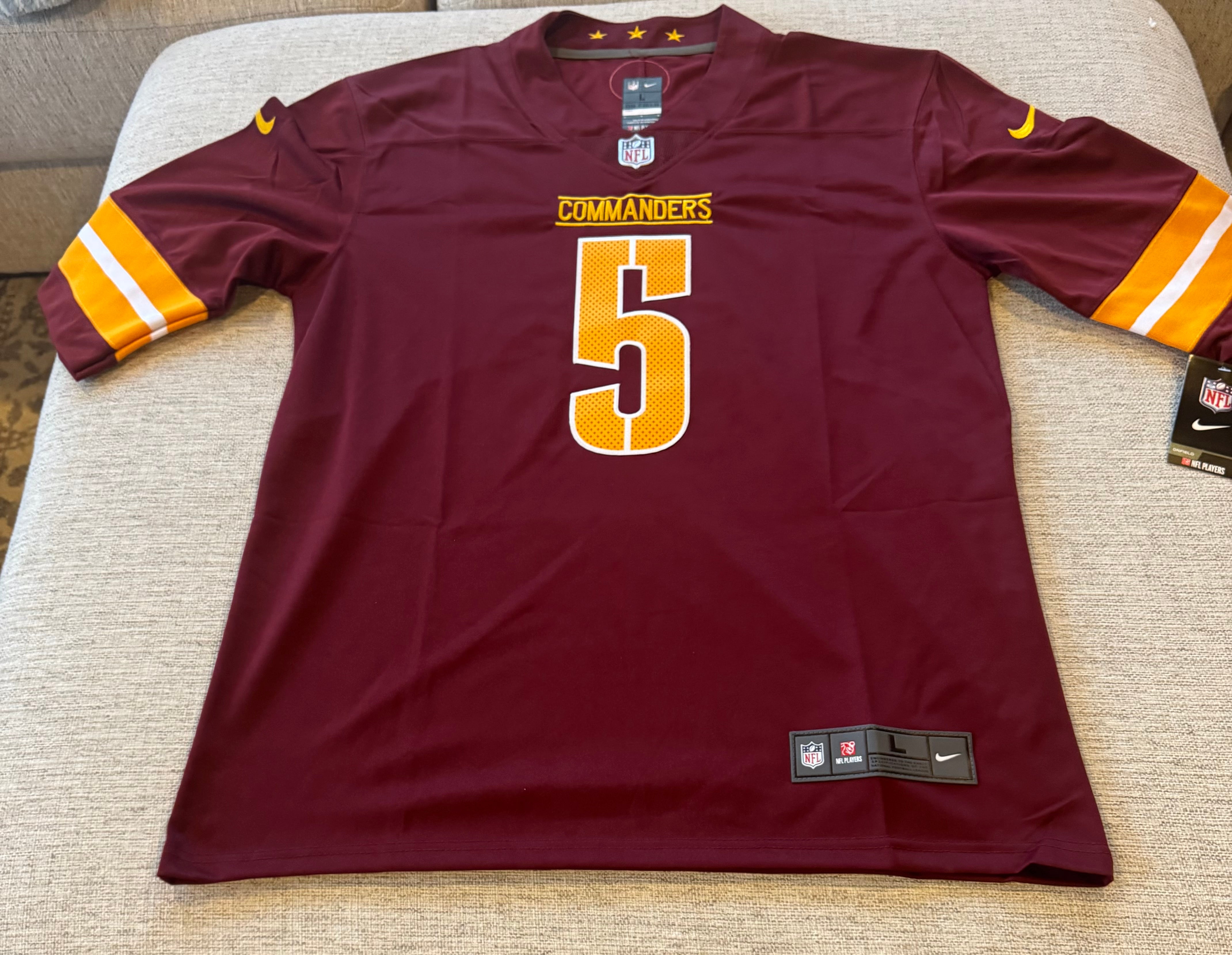 Washington Commanders Jayden Daniels NFL jersey with #5, authentic sports fan apparel, featuring team logo and player name.